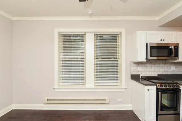 a kitchen with a stove and a microwave