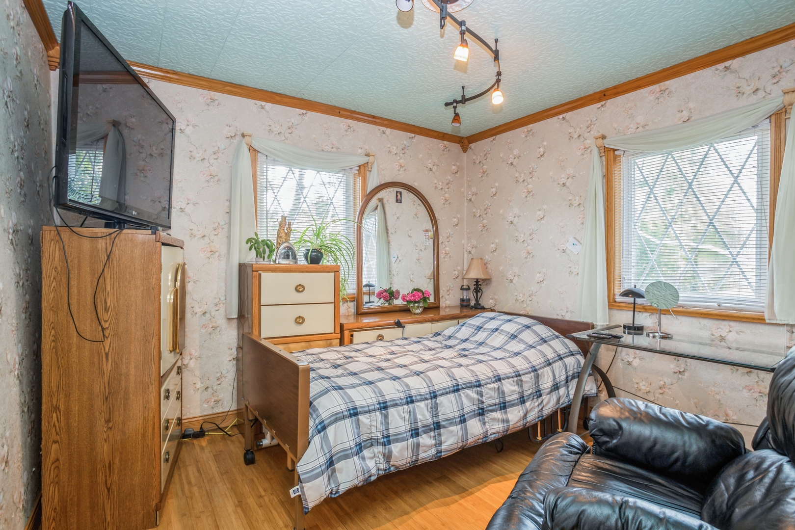 613 West Edgewood Road Lombard, IL 60148 - Photo 12 of 21 a bedroom with a bed couch and a window