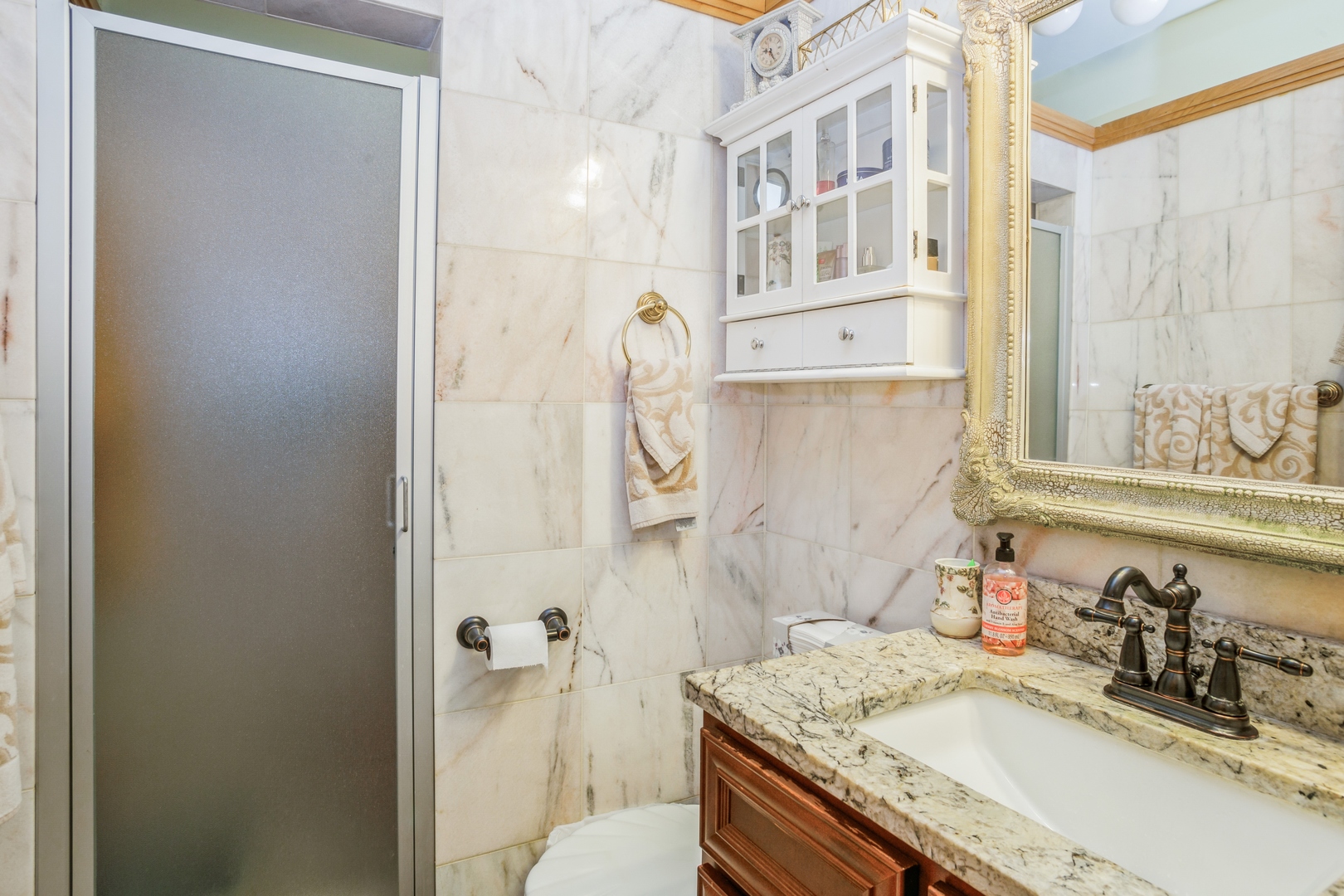 613 West Edgewood Road Lombard, IL 60148 - Photo 14 of 21 a bathroom with a granite countertop sink and a mirror