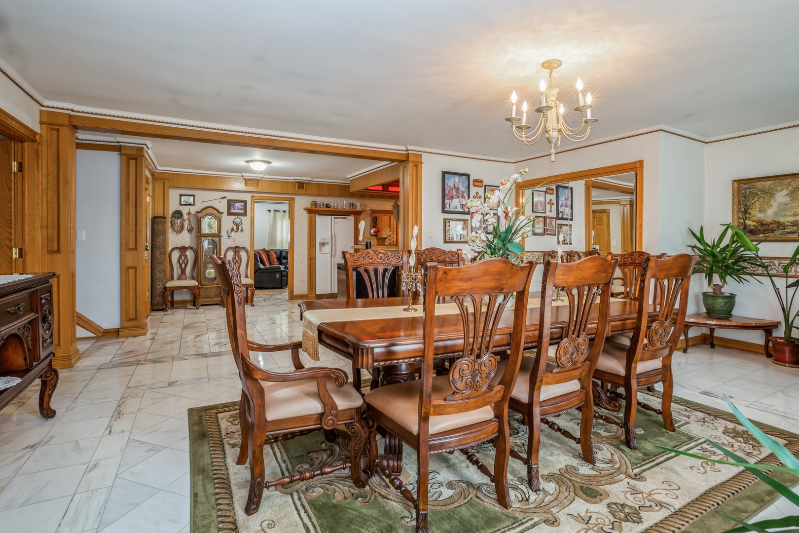 613 West Edgewood Road Lombard, IL 60148 - Photo 6 of 21 a dining room with furniture chandelier and wooden floor