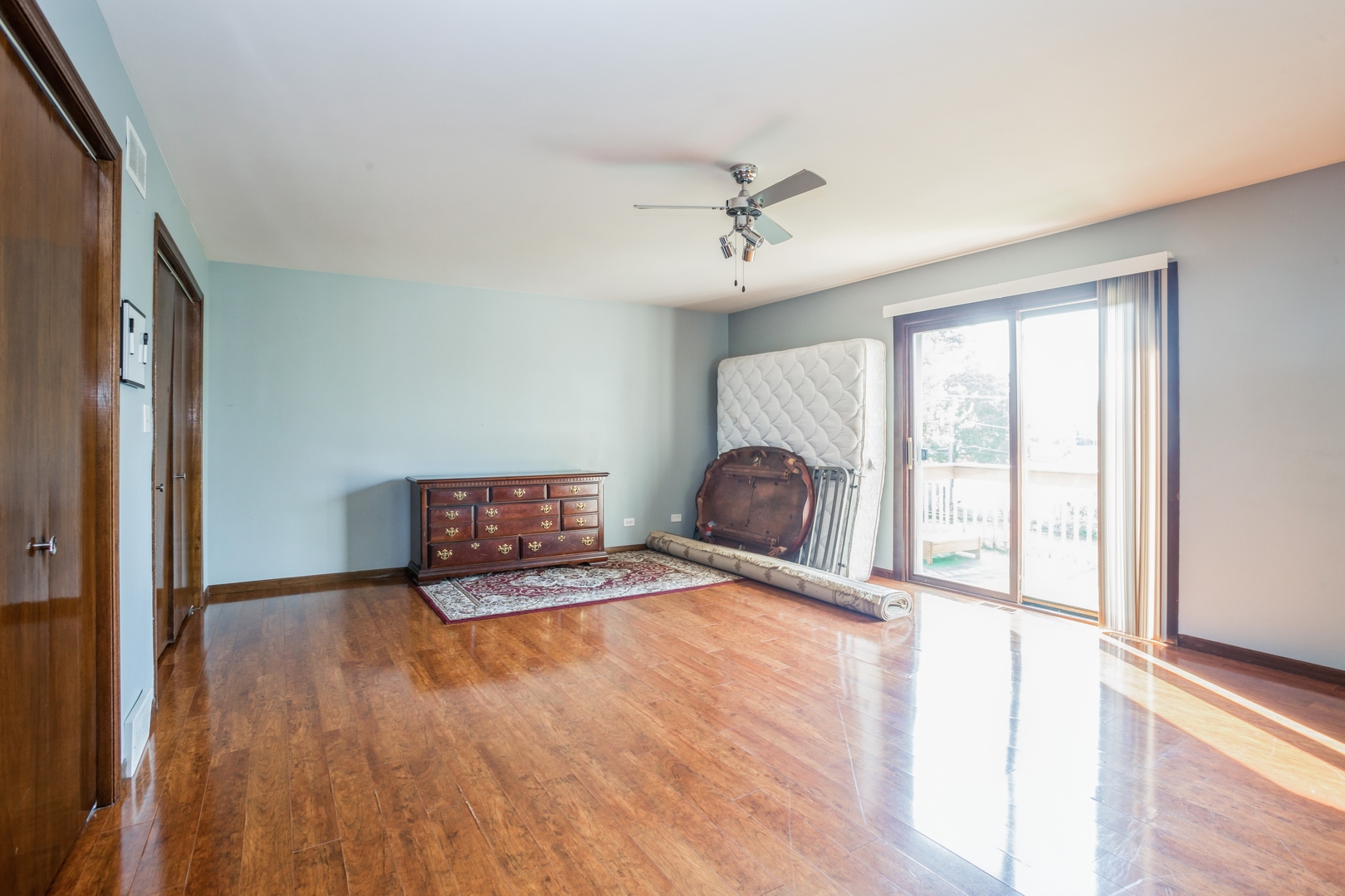 613 West Edgewood Road Lombard, IL 60148 - Photo 10 of 21 a view of an empty room with a window and wooden floor