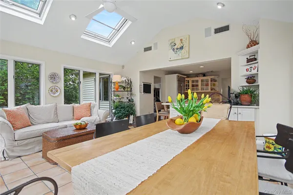 a living room with furniture or couch and a potted plant
