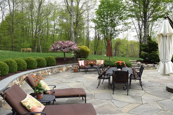 a view of a tables and chairs in a patio
