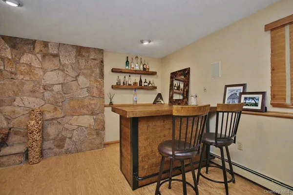 a view of a livingroom with furniture and wooden floor