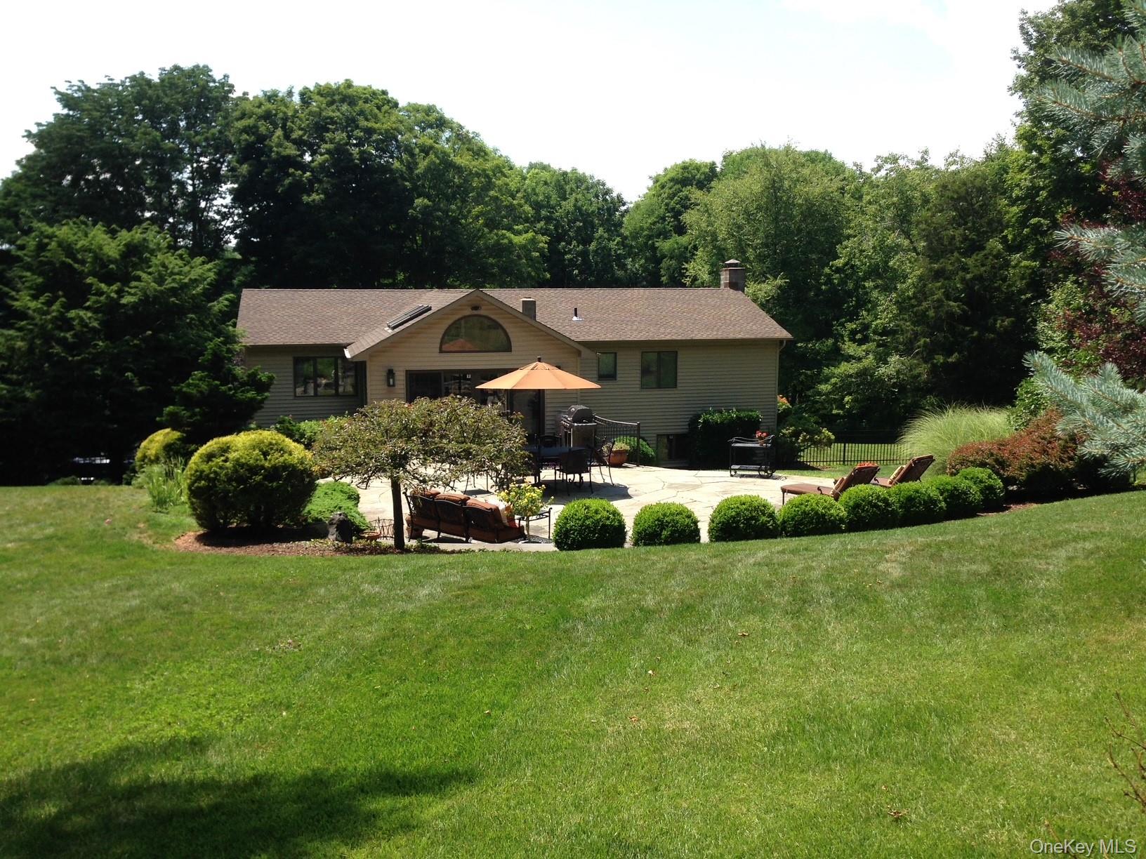 102 Nicholson Road Holmes, NY 12531 - Photo 6 of 44 Backyard looking at the Home in Summertime