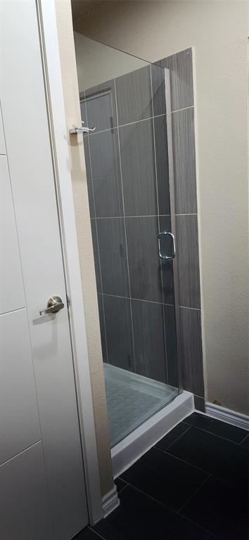 1100 West Trinity Mills Road, Unit 3003 Carrollton, TX 75006 - Photo 25 of 26 a bathroom with a shower and a sink