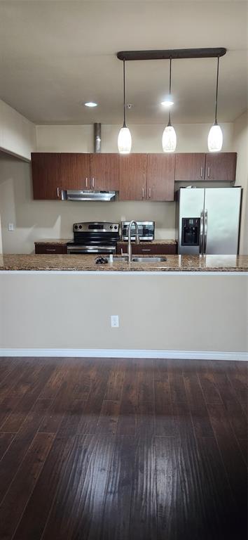 1100 West Trinity Mills Road, Unit 3003 Carrollton, TX 75006 - Photo 10 of 26 a large kitchen with lots of counter space and a sink