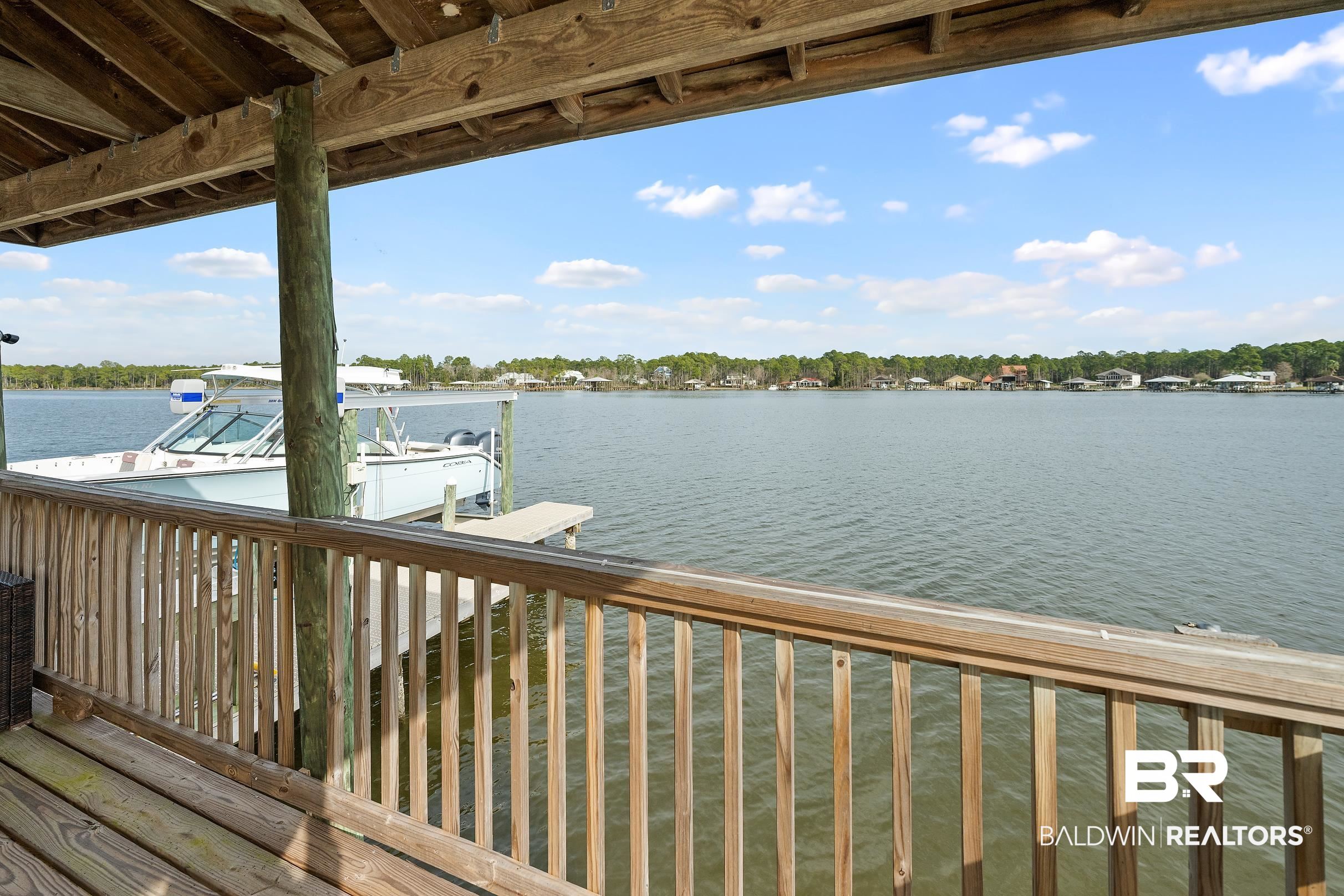 8490 Bay View Drive Foley, AL 36535 - Photo 13 of 67 Dock area featuring a water view and boat lift