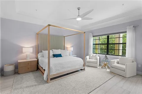 a bedroom with a bed and a couch