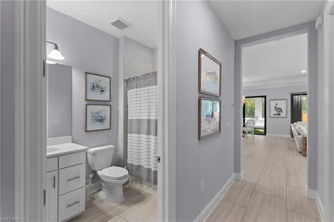 a bathroom with a toilet sink and shower