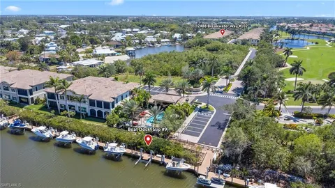 an aerial view of a houses with a lake view
