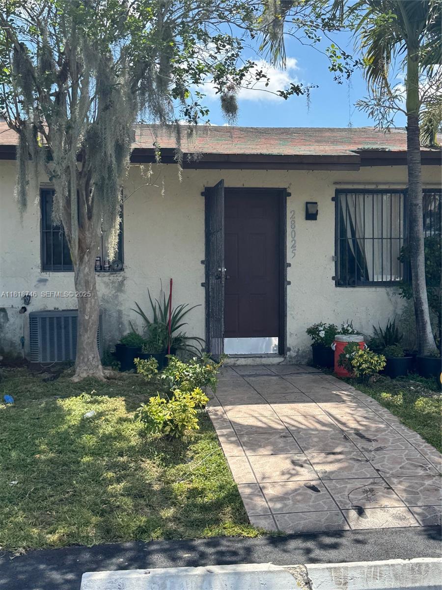 28152 Southwest 142nd Court Homestead, FL 33033 - Photo 8 of 12 a view of a backyard of a house