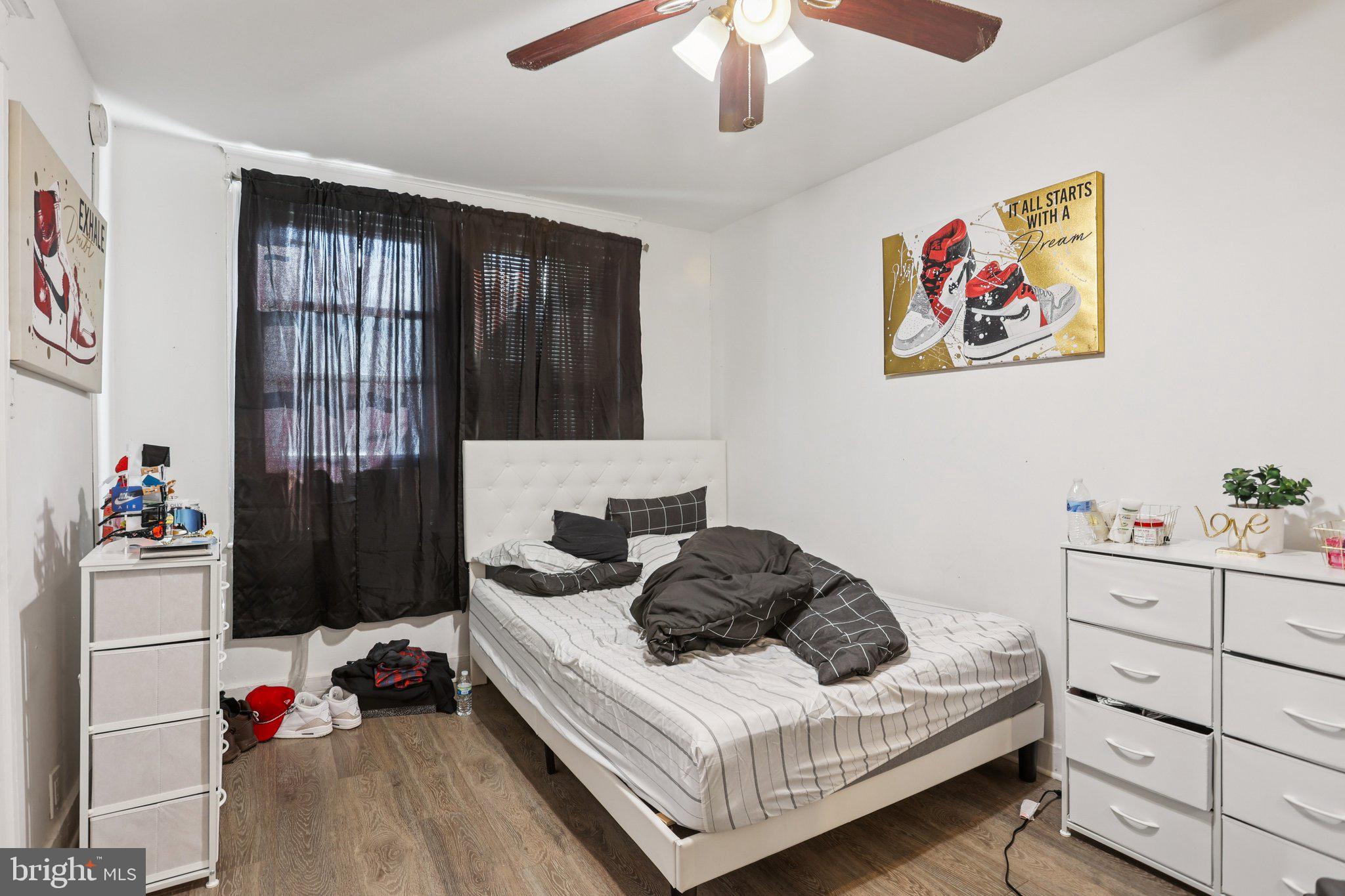 1540 Adams Avenue Philadelphia, PA 19124 - Photo 11 of 43 a bedroom with a bed and a chandelier