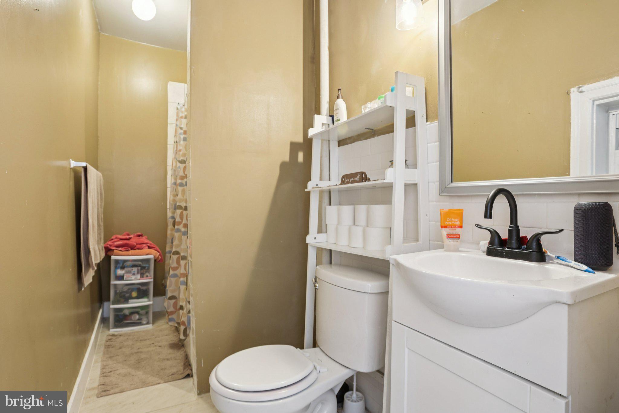1540 Adams Avenue Philadelphia, PA 19124 - Photo 15 of 43 a bathroom with a sink a toilet and shower