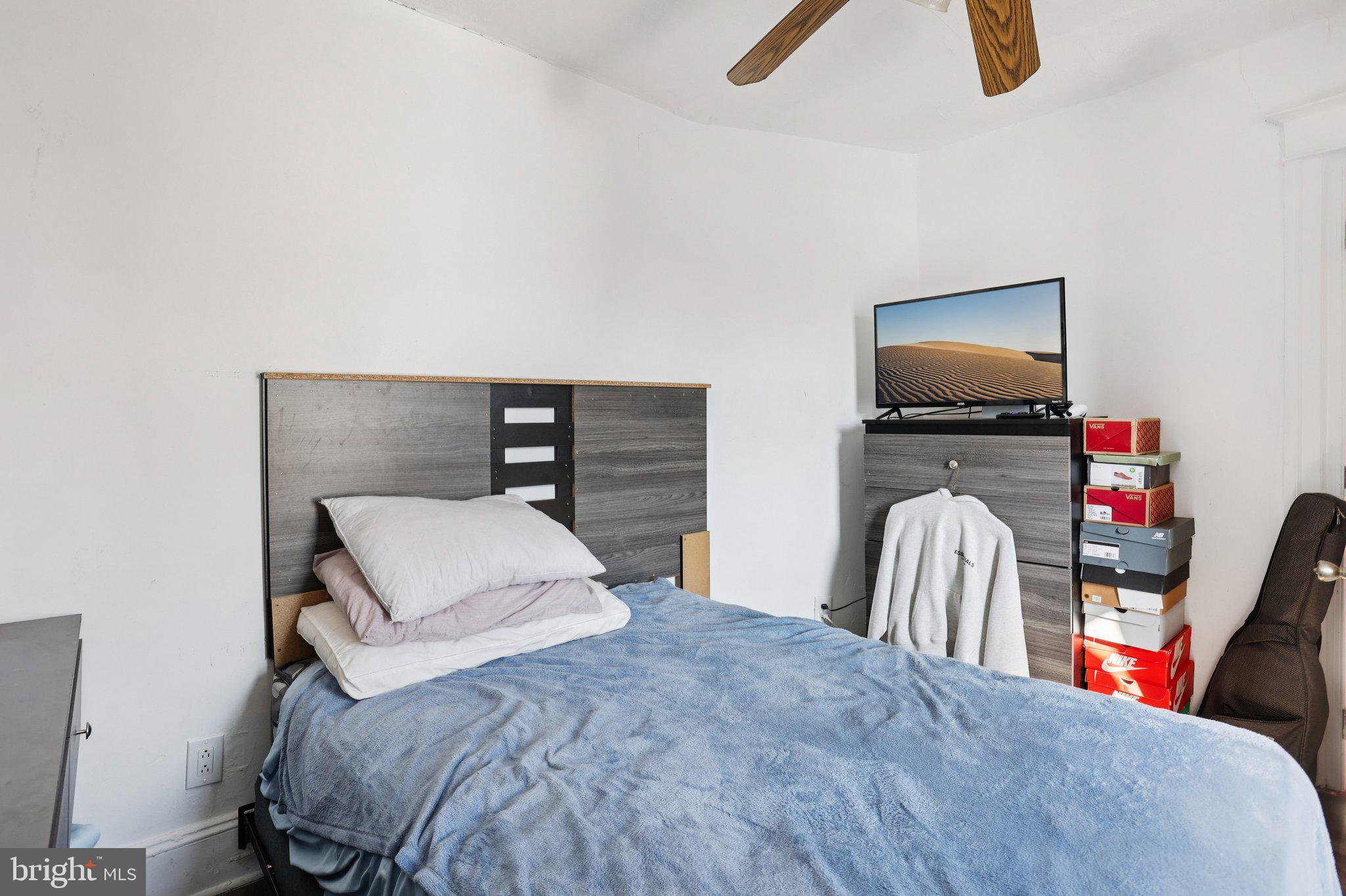 1540 Adams Avenue Philadelphia, PA 19124 - Photo 21 of 43 a bedroom with furniture and a flat screen tv