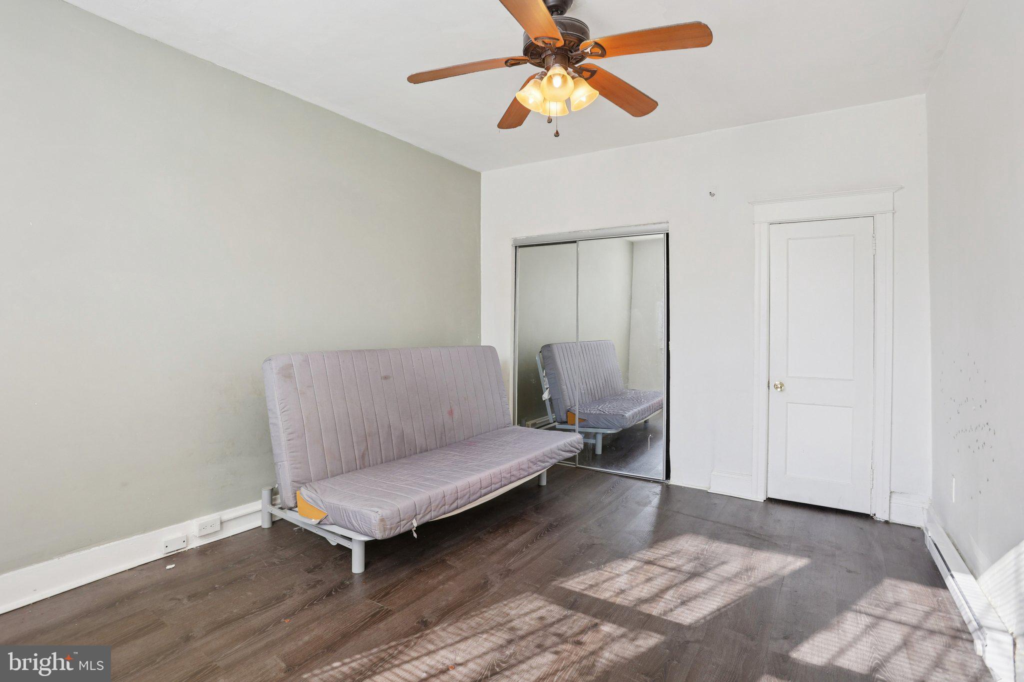 1540 Adams Avenue Philadelphia, PA 19124 - Photo 38 of 43 a living room with a couch and a chandelier