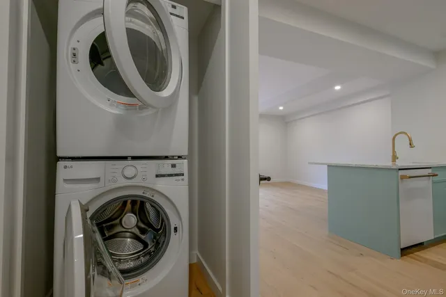 a view of a hallway with washer and dryer