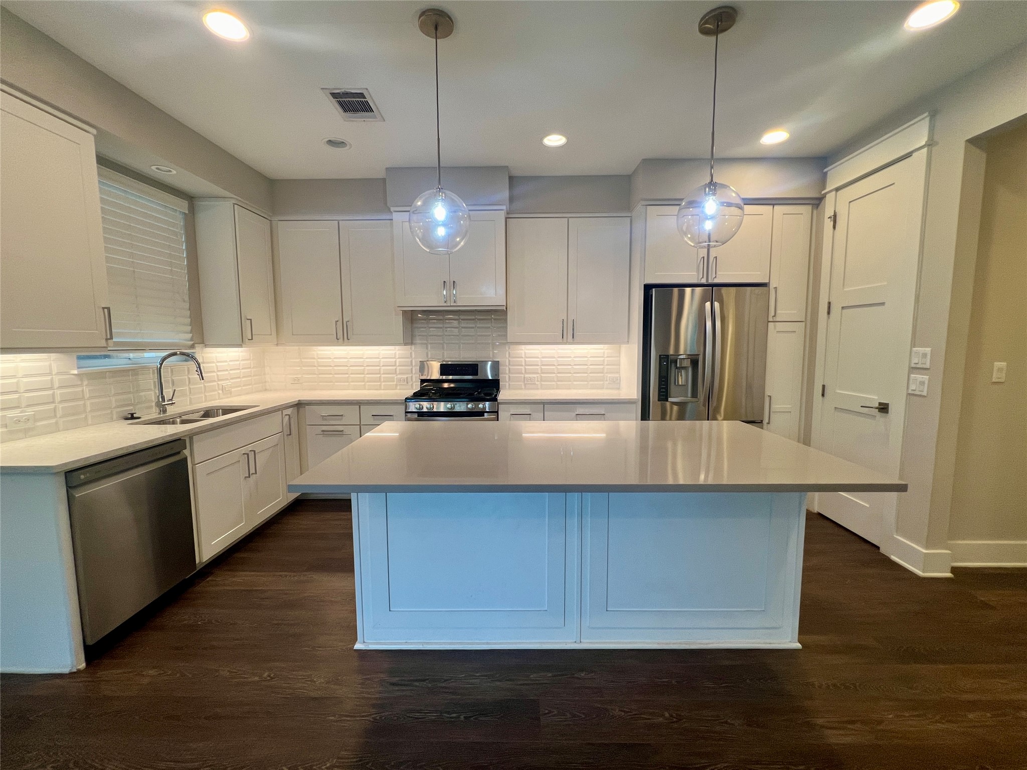 6515 Davis Lane, Unit 10 Austin, TX 78749 - Photo 5 of 22 A sleek kitchen island provides a central gathering point in this contemporary culinary space.