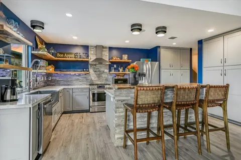 a bathroom with a sink and mirror