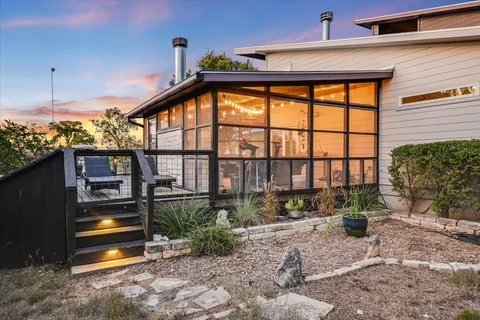 a living room with fireplace furniture and a fireplace