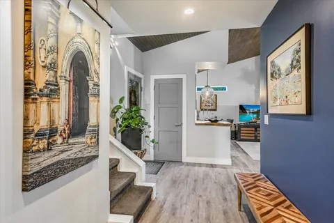 a living room with furniture a window and fireplace