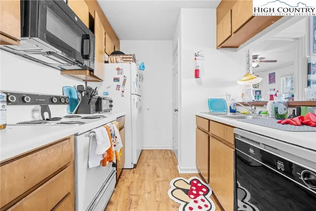 a utility room with sink dryer and washer