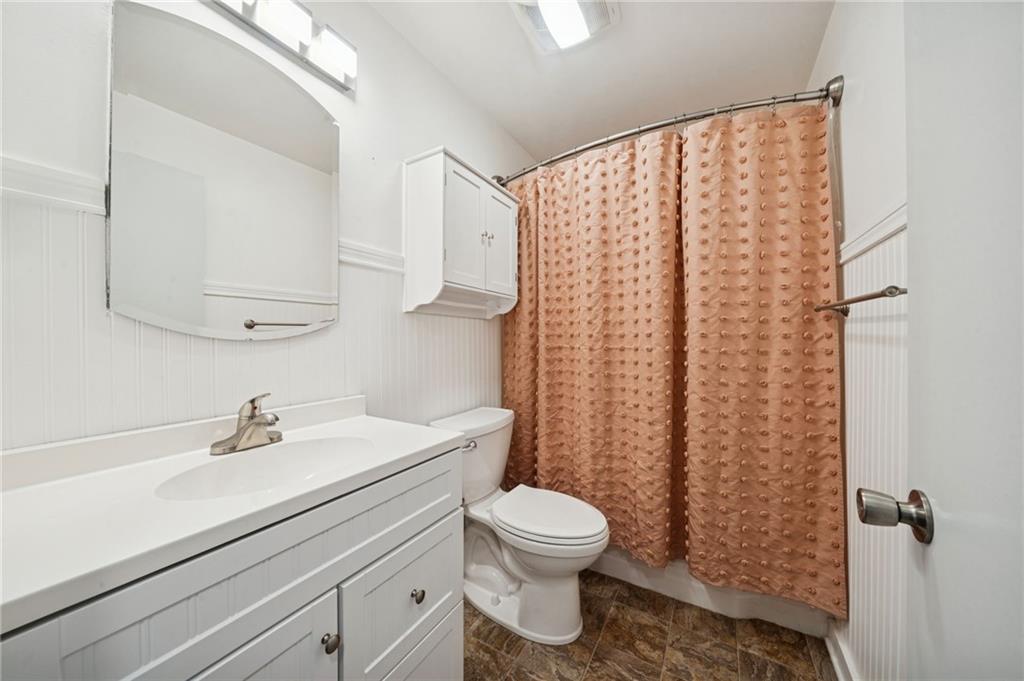 253 Stewart Street Elizabeth, PA 15037 - Photo 11 of 23 a bathroom with a sink a toilet and a mirror