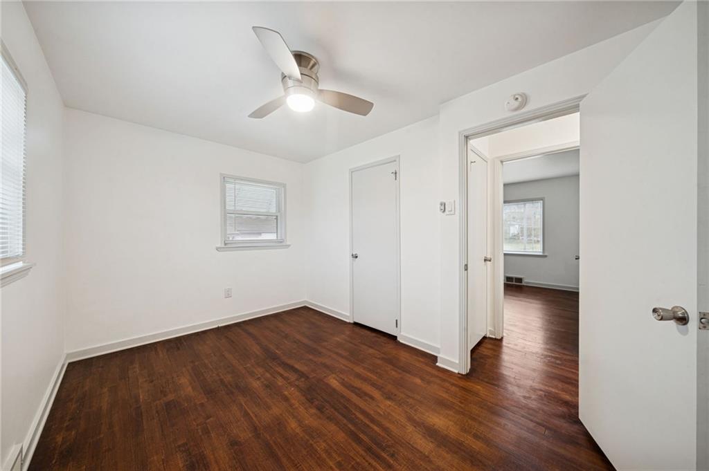 253 Stewart Street Elizabeth, PA 15037 - Photo 12 of 23 an empty room with wooden floor and windows