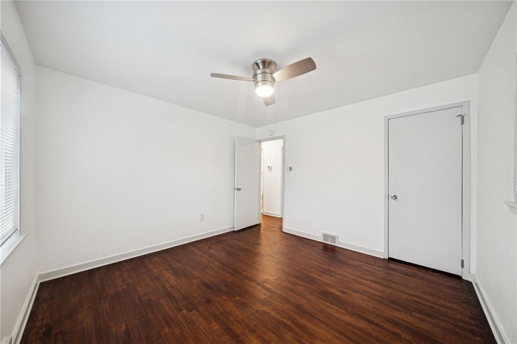 253 Stewart Street Elizabeth, PA 15037 - Photo 15 of 23 an empty room with wooden floor ceiling fan and windows