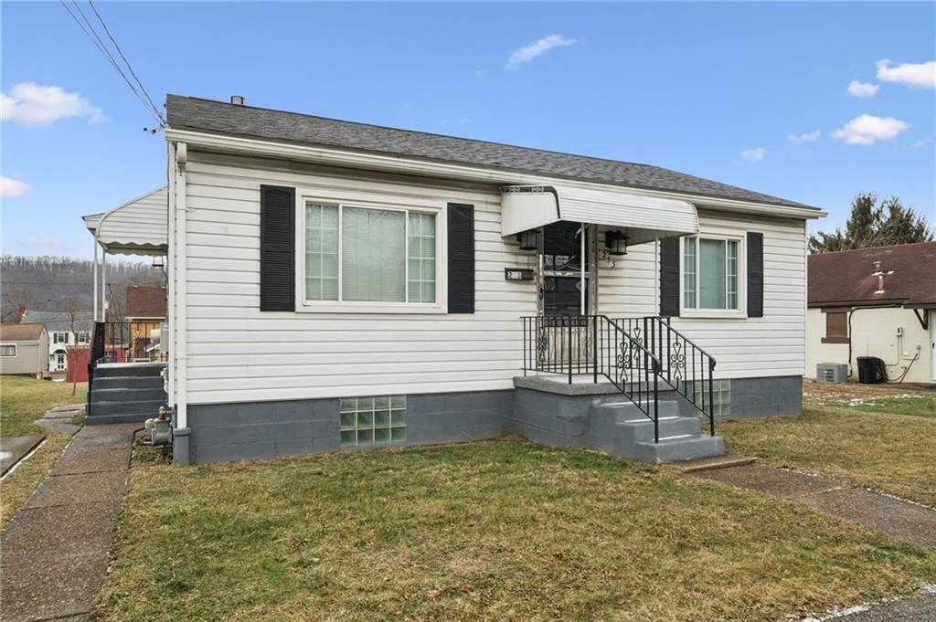 253 Stewart Street Elizabeth, PA 15037 - Photo 2 of 23 a front view of a house with garden