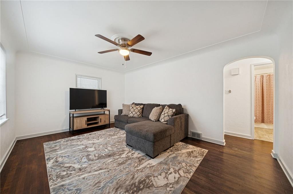 253 Stewart Street Elizabeth, PA 15037 - Photo 6 of 23 a living room with a couch and a flat screen tv