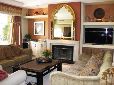 68 Oak Tree Drive Rancho Mirage, CA 92270 - Photo 1 of 23 a living room with furniture a fireplace and a large window