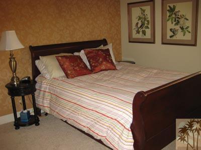 68 Oak Tree Drive Rancho Mirage, CA 92270 - Photo 15 of 23 a bedroom with a bed and a painting on the wall