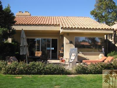 68 Oak Tree Drive Rancho Mirage, CA 92270 - Photo 20 of 23 a view of a house with porch and garden