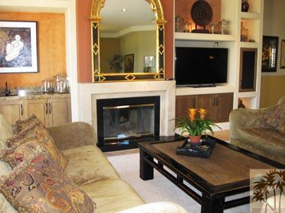 68 Oak Tree Drive Rancho Mirage, CA 92270 - Photo 2 of 23 a living room with furniture a flat screen tv and a fireplace