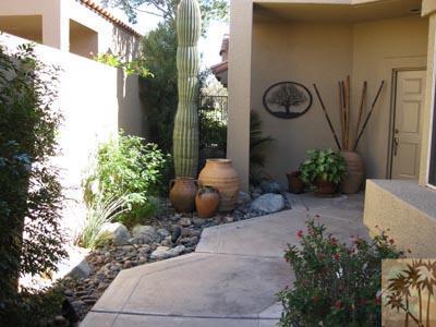 68 Oak Tree Drive Rancho Mirage, CA 92270 - Photo 21 of 23 a vase of flowers sitting on a floor