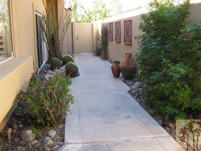 68 Oak Tree Drive Rancho Mirage, CA 92270 - Photo 22 of 23 a view of a backyard with potted plants