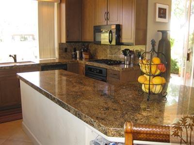 68 Oak Tree Drive Rancho Mirage, CA 92270 - Photo 3 of 23 a kitchen with stainless steel appliances granite countertop a sink a counter top space and cabinets