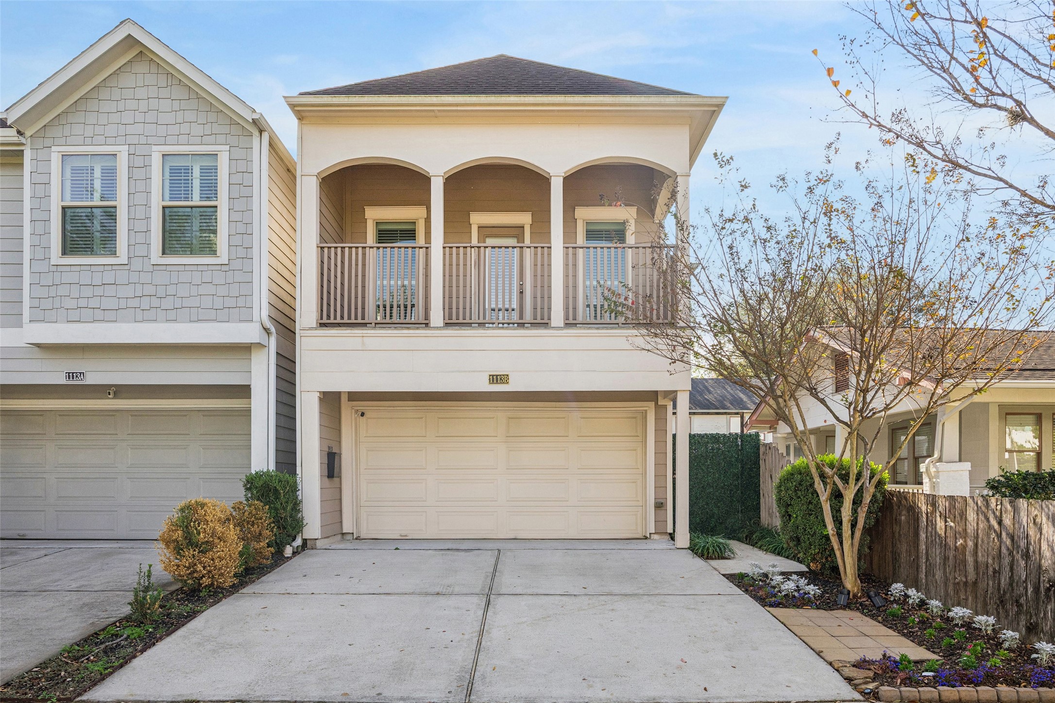 a front view of a house with garage