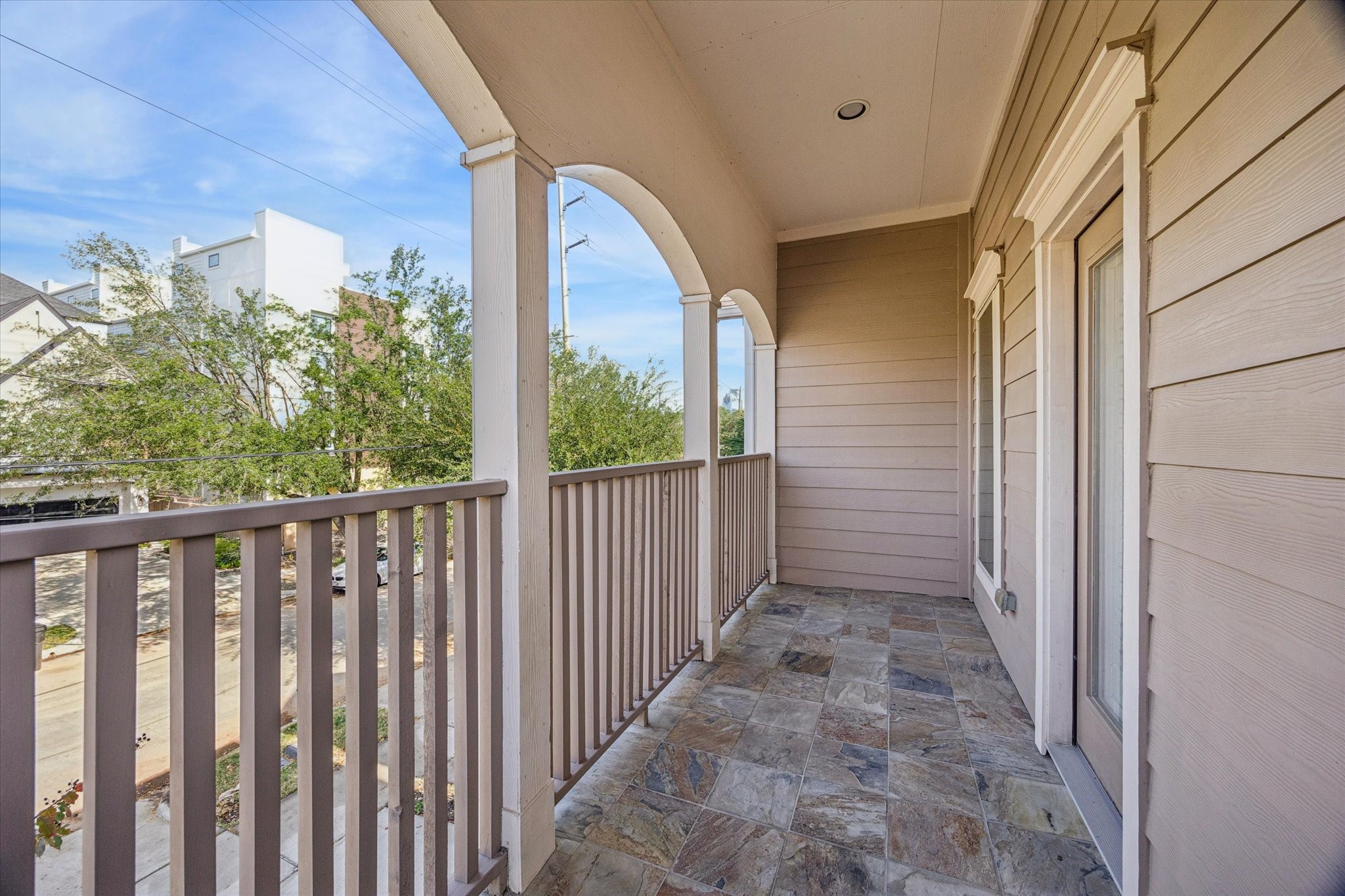 1113 Peden Street, Unit B Houston, TX 77006 - Photo 11 of 19 a view of a balcony with wooden floor