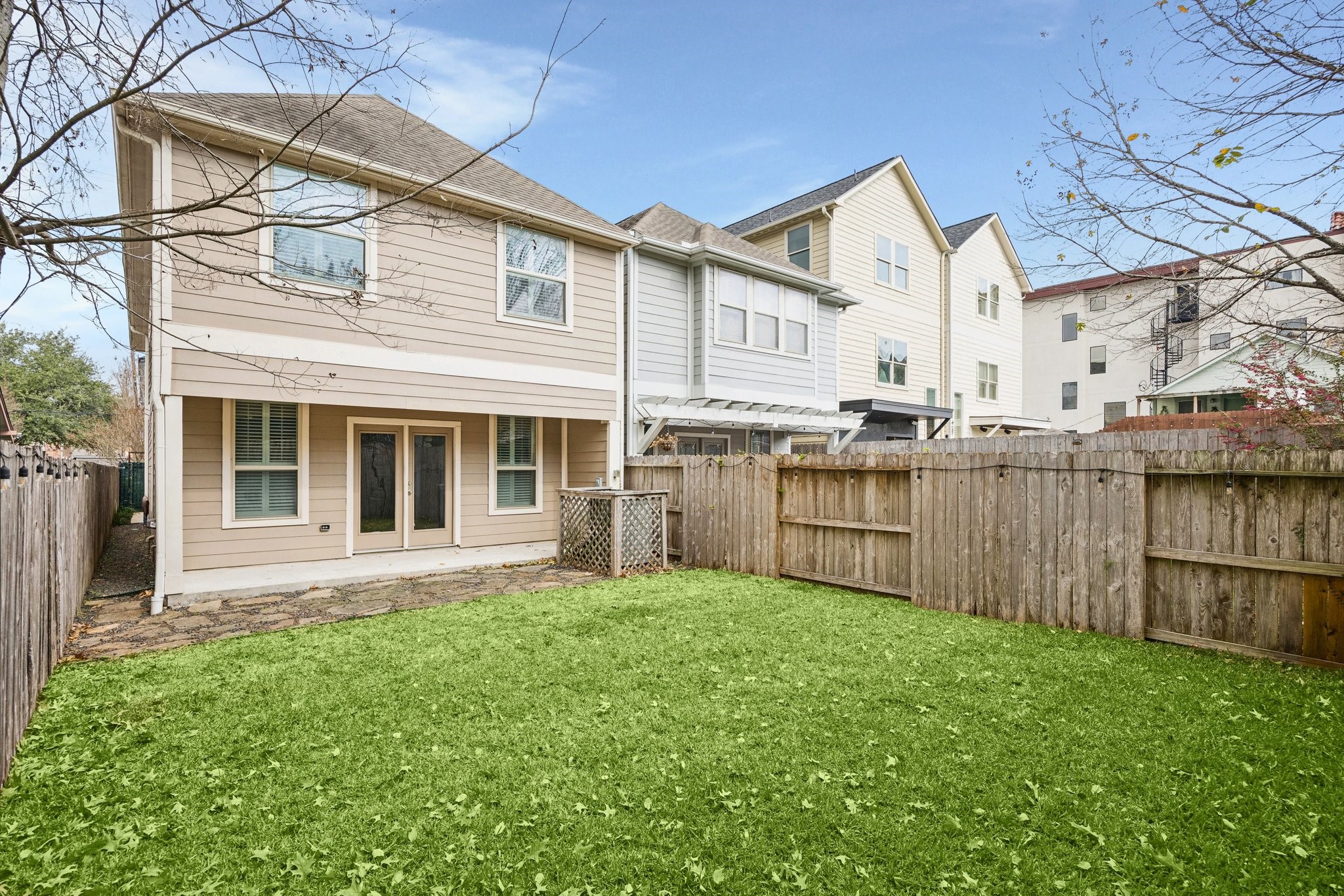 1113 Peden Street, Unit B Houston, TX 77006 - Photo 2 of 19 a view of a house with a yard and sitting area