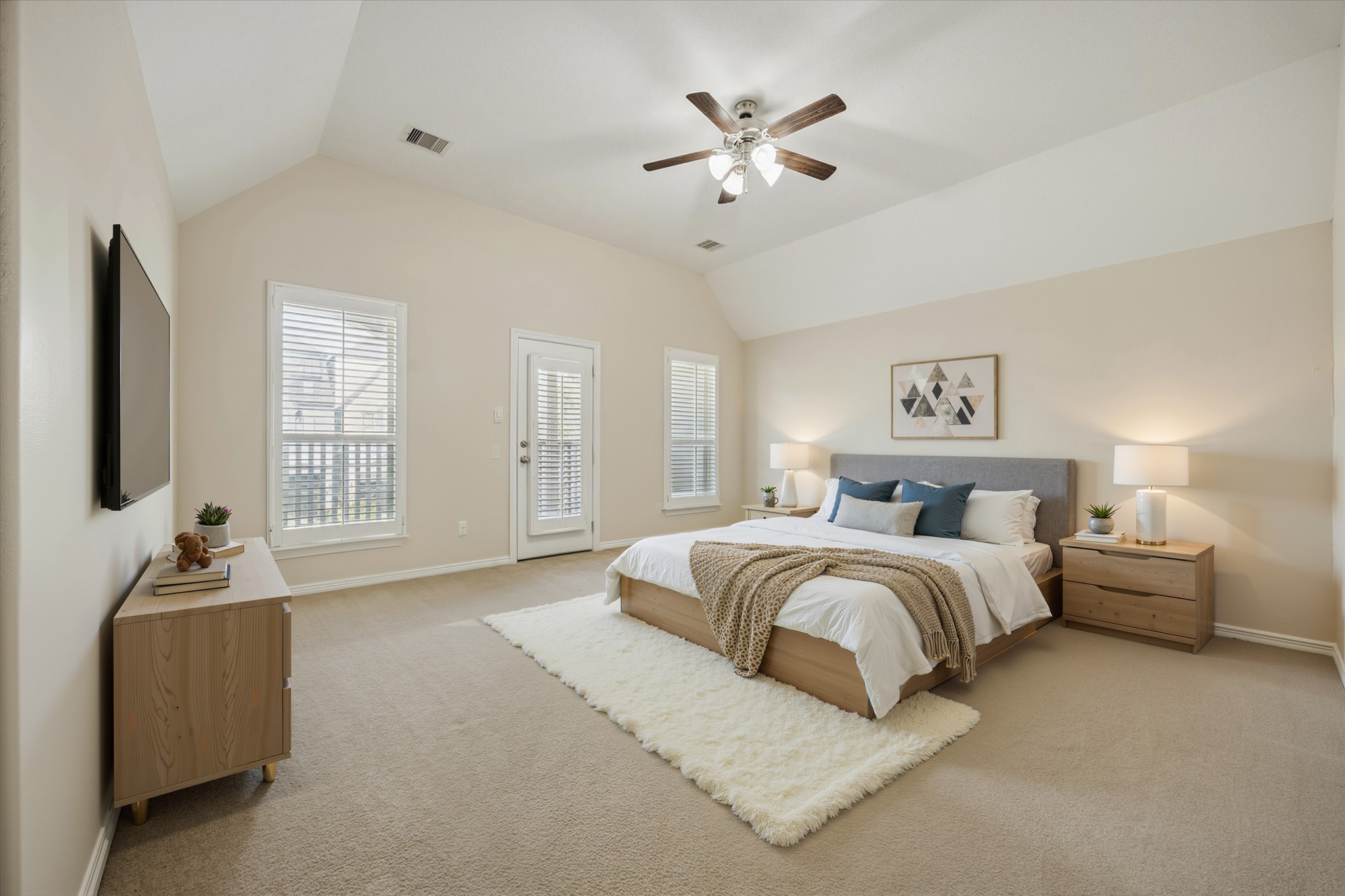 1113 Peden Street, Unit B Houston, TX 77006 - Photo 10 of 19 a spacious bedroom with a bed and a chandelier