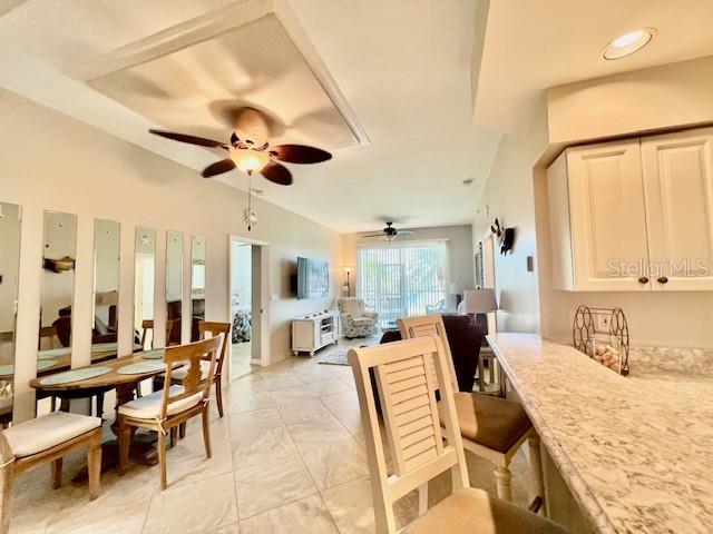 2060 Matecumbe Key Road, Unit 2102 Punta Gorda, FL 33955 - Photo 11 of 51 a living room with furniture kitchen view and a large window
