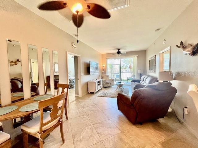 2060 Matecumbe Key Road, Unit 2102 Punta Gorda, FL 33955 - Photo 17 of 51 a living room with furniture kitchen view and a chandelier