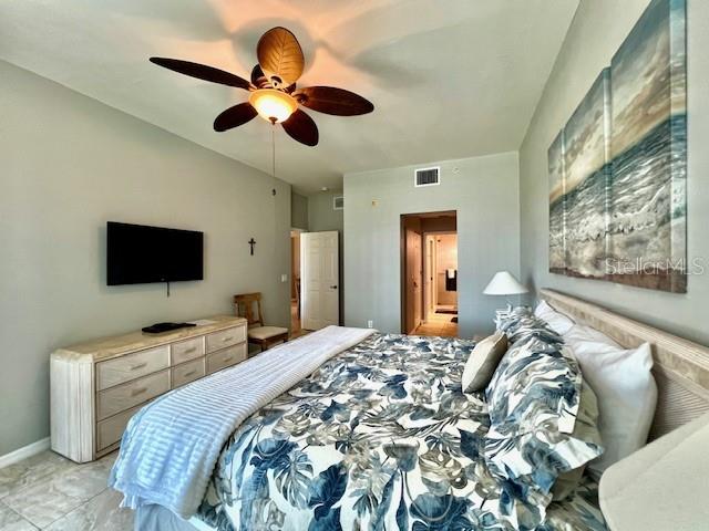2060 Matecumbe Key Road, Unit 2102 Punta Gorda, FL 33955 - Photo 19 of 51 a bedroom with a bed and a flat screen tv