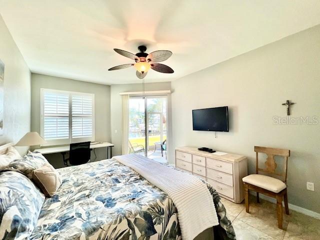 2060 Matecumbe Key Road, Unit 2102 Punta Gorda, FL 33955 - Photo 20 of 51 a bedroom with a bed and a flat screen tv