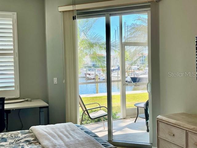 2060 Matecumbe Key Road, Unit 2102 Punta Gorda, FL 33955 - Photo 21 of 51 a bedroom with a bed and wooden floor