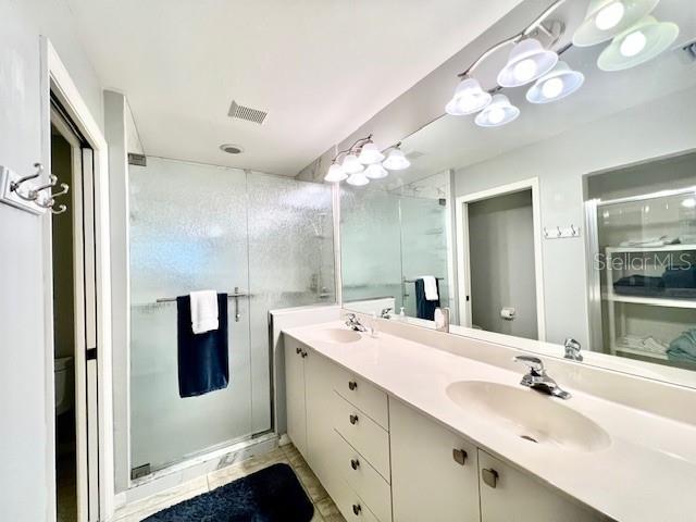 2060 Matecumbe Key Road, Unit 2102 Punta Gorda, FL 33955 - Photo 23 of 51 a spacious bathroom with a double vanity sink and a mirror