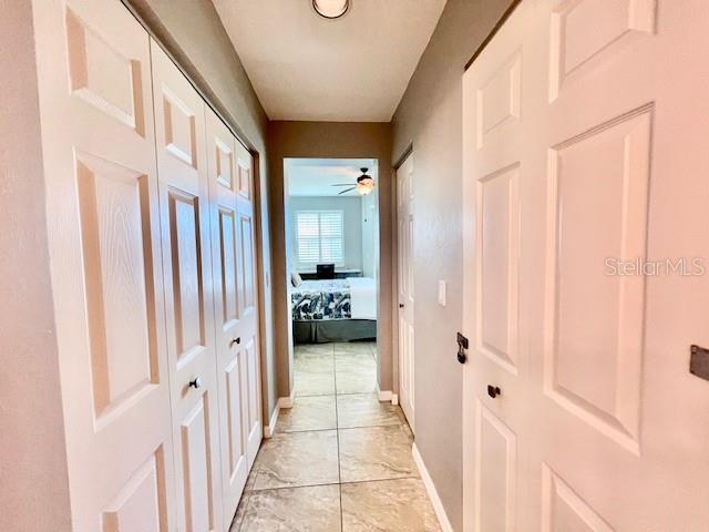 2060 Matecumbe Key Road, Unit 2102 Punta Gorda, FL 33955 - Photo 28 of 51 a view of a hallway with a livingroom and a bathroom