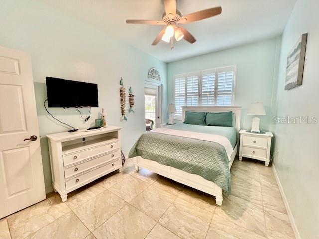 2060 Matecumbe Key Road, Unit 2102 Punta Gorda, FL 33955 - Photo 29 of 51 a bedroom with a bed and flat screen tv